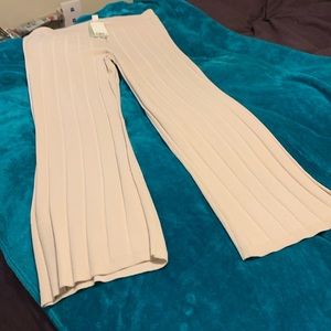 Beige pleated pants that match dress.